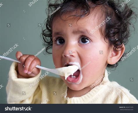 Happy Baby Eating Porridge With Spoon Stock Photo 202471375 Shutterstock