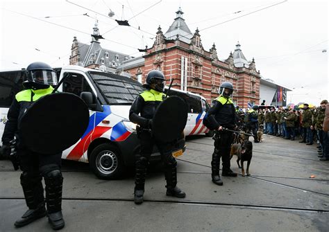 dutch police disperse anti lockdown protesters in amsterdam reuters