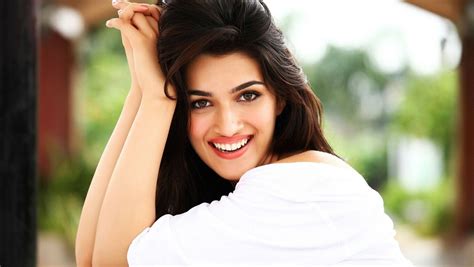 1360x768 Kriti Sanon Smiling Laptop Hd Hd 4k Wallpapers Images Backgrounds Photos And Pictures