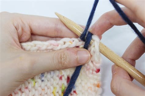 It is usual to knit the neckband on a smaller needle than is used for the main body of the knitting and this also makes it easier to pick up stitches using a smaller size needle. Image: photo-6