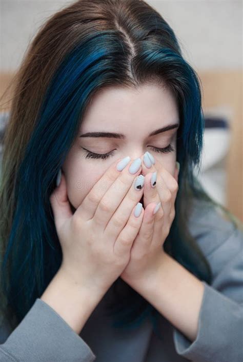 A Teenage Girl With Blue Hair Is Sad And Depressed Stock Photo Image