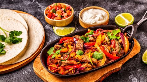 The Real Difference Between Fajitas And Tacos