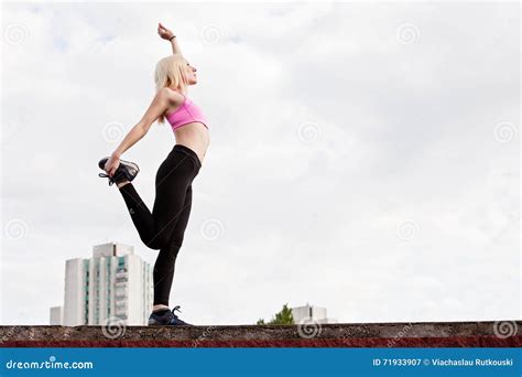 Young Blonde Woman Is Doing Squat Outdoors Stock Image Image Of