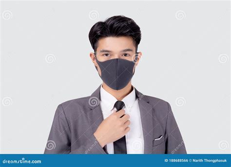 Portrait Young Asian Businessman In Suit Wearing Face Mask For