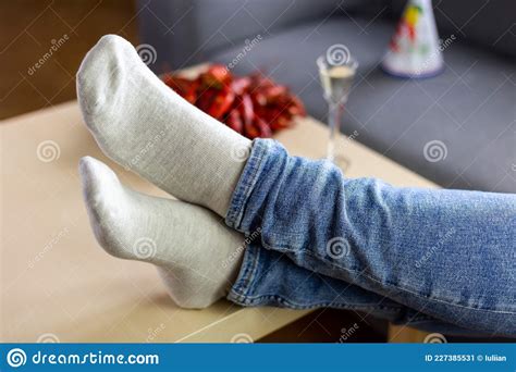 Celebrating Swedish Fest Kraftskiva Woman Laying In Sofa Holding Her Legs On Table Stock Image