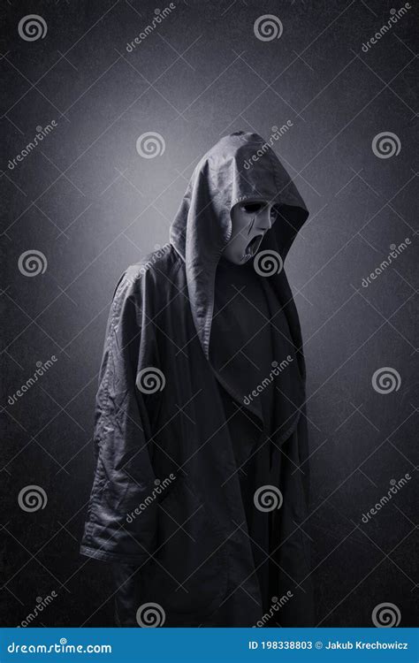 Scary Figure With Mask In Hooded Cloak Stock Image