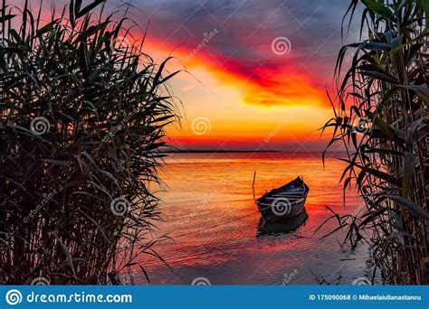 Beautiful Morning Landscape With A Boat On The Lake At The Sunrise