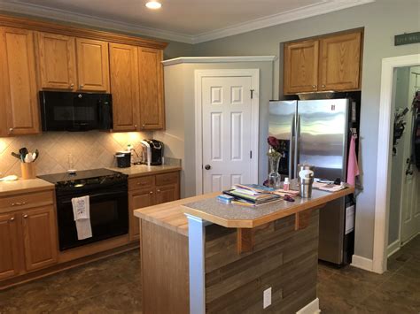 Harper island with metro glamour. Caviar Oak Kitchen + Island cabinets - 2 Cabinet Girls