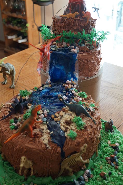 Ultimate dino cake cake by @beautifullybakedbysara. Dinosaur Cake love the idea of the flying Dino's ...