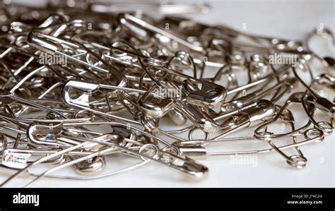 Pile Of Metal Safety Pins As Background Stock Photo Alamy