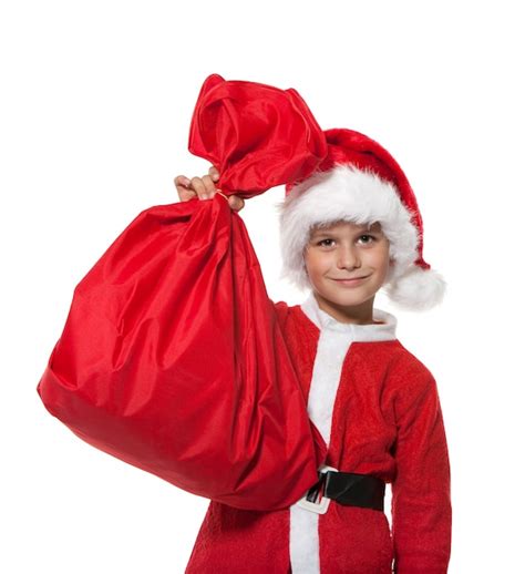 Premium Photo Boy Santa Claus Holding A Sack