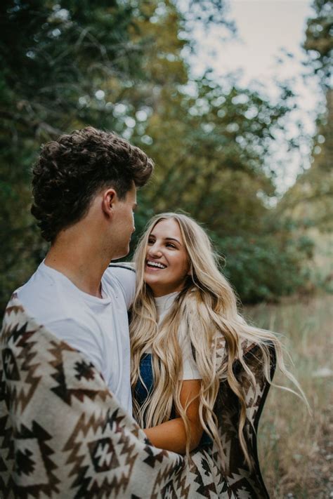 Romantic Forest Engagement Session Couple Wrapped In Blanket In Utah