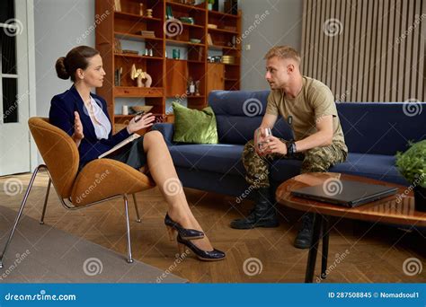 Upset Military Man Having Therapy Session With Psychologist Stock Image