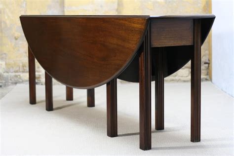 This specific kitchen table presents a touch of elegance and class to any personal dining room. Georgian Style Large Drop-Leaf Mahogany Dining Table from ...
