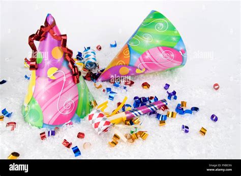 Party Hats And Party Whistles On White Snow For New Years Eve Stock