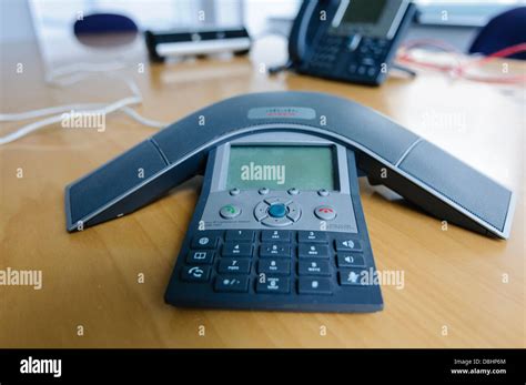 A Cisco Polycom Ip Spider Conference Phone In A Modern Office Stock