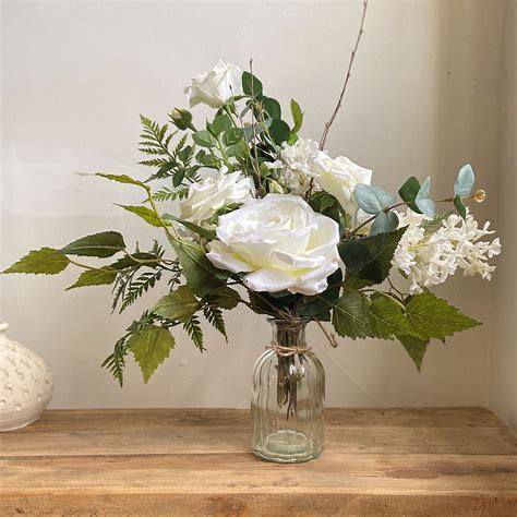 The secret to a good faux arrangement is choosing blooms and foliage that resemble the real thing as closely as possible. Posy Faux ~ Forest Fern & White Rose