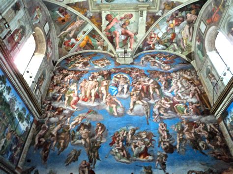 The Ceiling Is Painted With Many Different Paintings