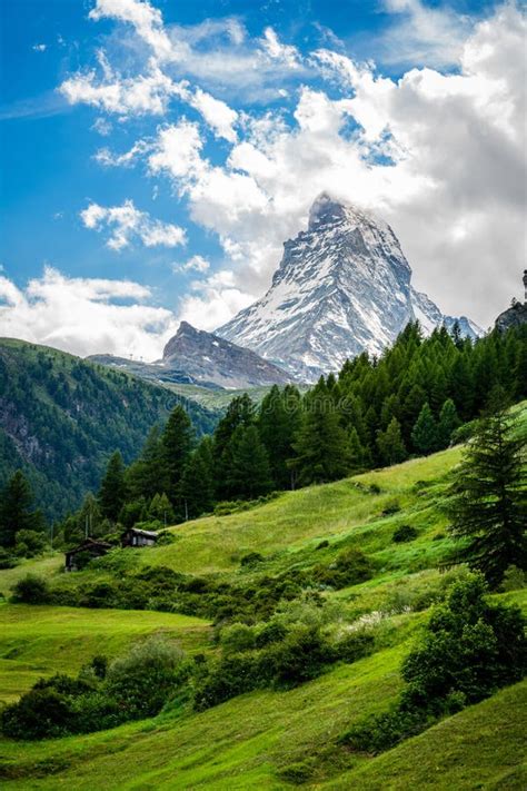 Vertical Scenic View Of The Matterhorn Mountain Summit With Snow Clouds
