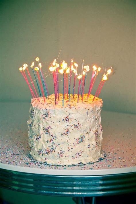 A birthday cake this tall requires a. Birthday cake with lots of candles and sprinkles! | Party ...