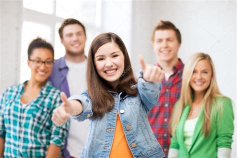 Students Showing Thumbs Up At School — Stock Photo © Sydaproductions