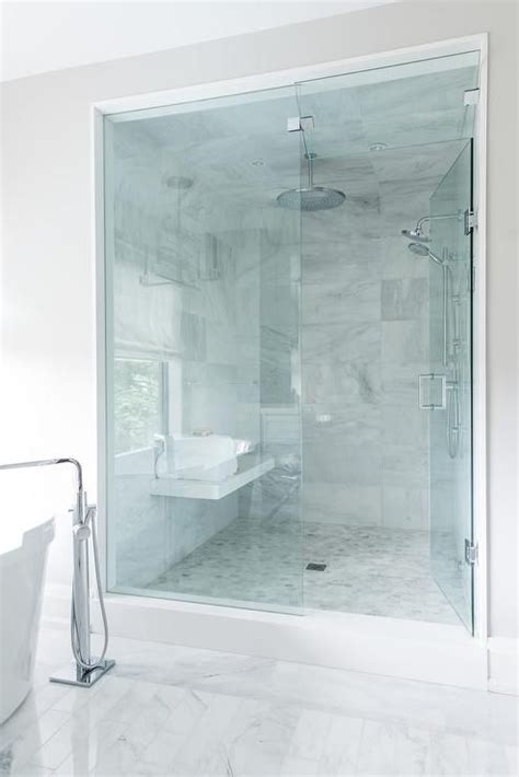 Architects, builders, and designers use cultured marble to create timeless works of art. Seamless glass door opens to a walk-in shower filled with ...