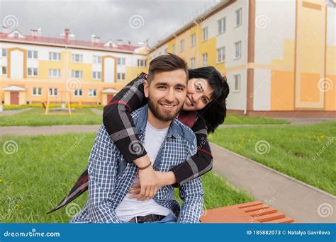 Happy Woman Hugs Man From Behind Stock Image Image Of Dreamy