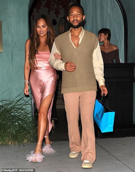 Chrissy Teigen Cuts A Glamorous Figure In Pink Satin Dress As She Steps Out With Husband John