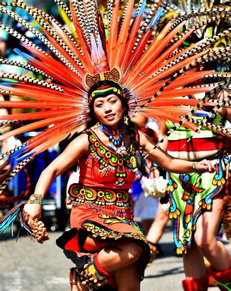 An Aztec Dancer Performs For The Crowd At The Cinco De Mayo Parade