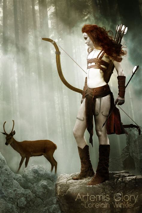A Woman Dressed As A Warrior With An Arrow And Bow Standing Next To A Deer