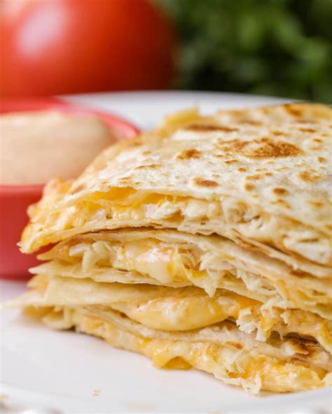 Then build the quesadillas by laying grated cheese on the bottom. FAVORITE Chicken Quesadilla Recipe | Lil' Luna