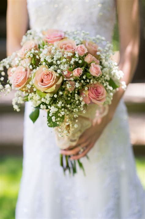 Bridal Bouquet Using Babys Breath Light Pink Roses And Lace Flowers