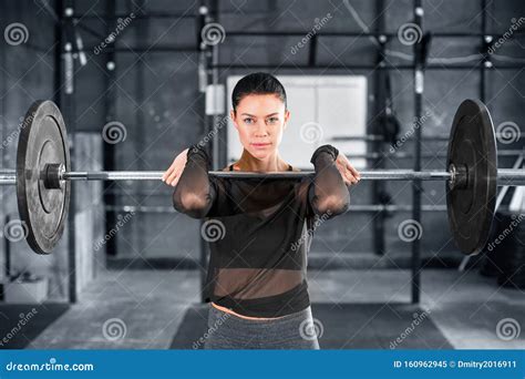 Female Powerlifter Doing A Clean And Jerk With Heavy Weights Royalty