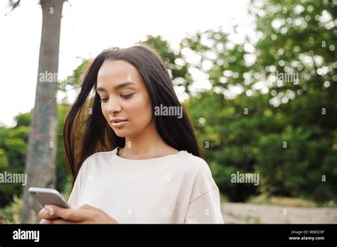 Portrait Of Beautiful Woman Wearing Lip Piercing Holding Smartphone