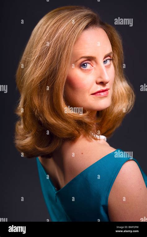 Sophisticated Blue Eyed Blonde Woman On Dark Background Stock Photo Alamy