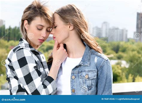 Lesbian Couple Embracing Embracing And Able To Kiss With Eyes Closed