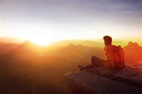 Free Photo Man Sitting On Edge Facing Sunset Adult Mountains