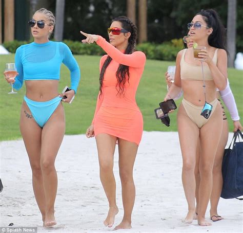 Kim Kardashian Flaunts Her Booty In Clingy Dress As She Has Some Girl