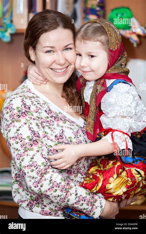 Happy Mother Holding Small Girl In Russian Traditional Clothes Russian