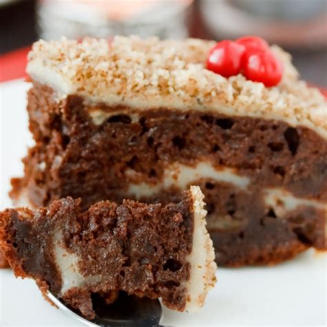 In a medium bowl, beat mascarpone and powdered sugar until smooth and spread the chocolate frosting on the top and sides of the cake using an offset spatula. Chocolate Cake With Cream Filling And Nut Frosting Recipe
