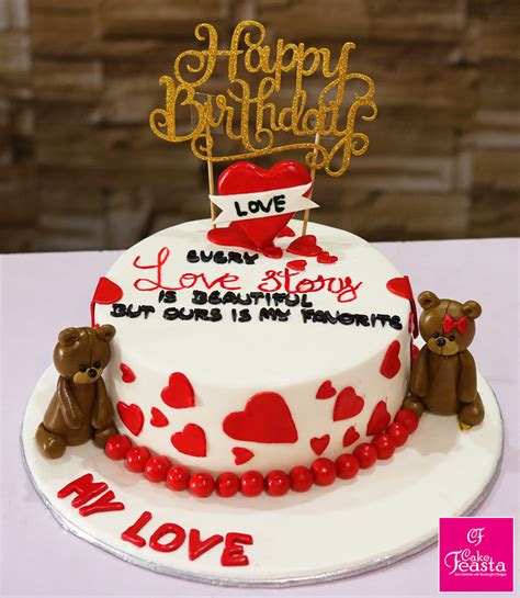 Happy anniversary celebration in gold with several numbers from 10 to 100. Heart Theme Love Story Anniversary Cake - Marriage anniversary cake