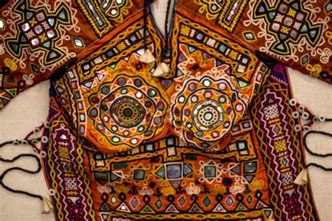 gujarat kutch embroidery sewing colors onto fabrics indian handicrafts handmade indian