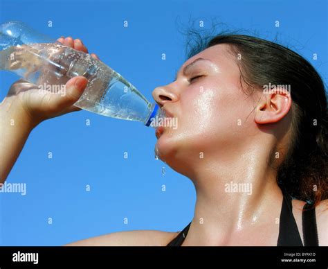 Young Woman Drinking Cold Water Stock Photo Alamy