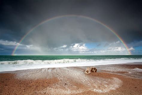 Big Beautiful Rainbow Over Ocean Waves Stock Photos