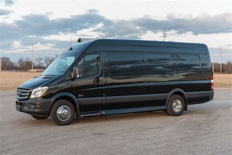 A Black Van Parked In A Parking Lot