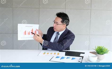 Businessman Presenting Business Plan Information At Office Meeting