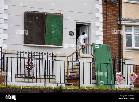 A Forensic Officer Works At A Property In Lenadoon Avenue In West