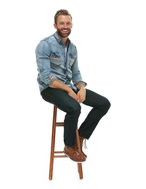 Cheerful man sitting on stool | Sitting pose reference, Man sitting, Sitting poses
