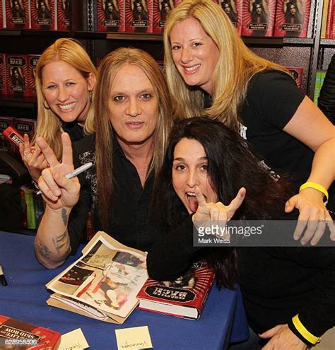 Sebastian Bach Signs Copies Of 18 And Life On Skid Row Photos And