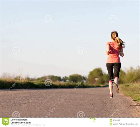 Girl Runs Along The Asphalt Road Stock Image Image Of Road Tracksuit 57854591